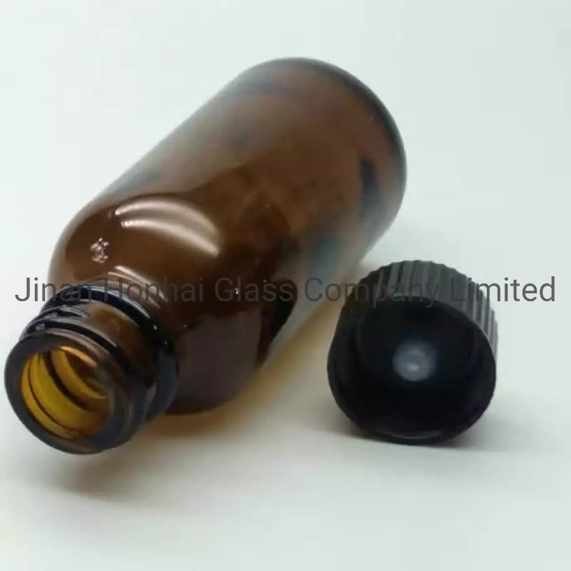 2 Oz (60ml) Amber Boston Round Bottle with Black Poly Cone Cap